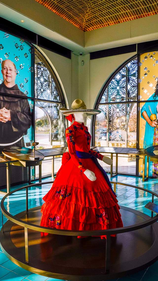 Interior view of World Heritage Center and mannequin in red dress.