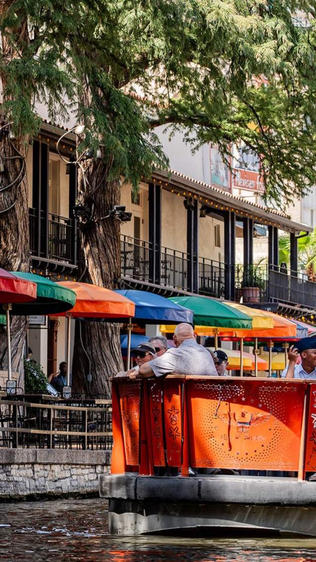 river barge and iconic colored umbrellas at San Antonio River Walk