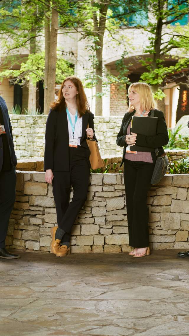 Group of meeting professionals gathering in front of grotto at Henry B.Gonzalez Convention Center