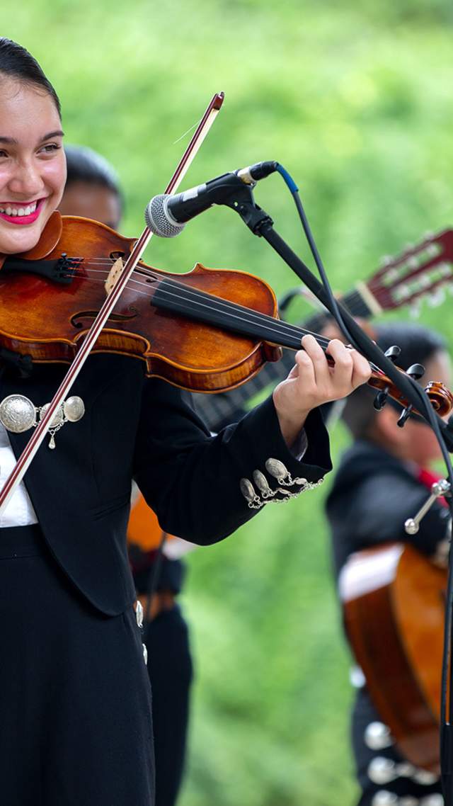 Mariachi band member playing violin