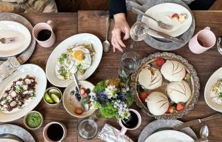 food spread out on a table with brunch food