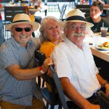 people posing for photo at restaurant