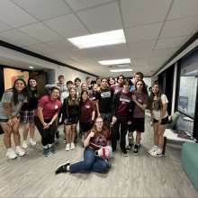 volunteers posing for photo in office