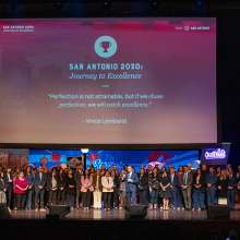 Group of people gathered onstage