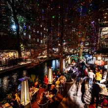 San Antonio River Walk at night with holiday lights