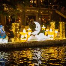 Moon and stars illuminated on river barge