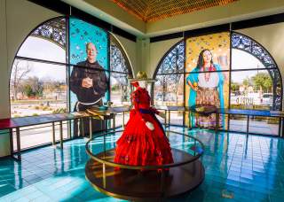 Interior view of World Heritage Center and mannequin in red dress.