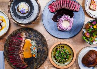 Overhead view of food spread at Isidore at Pullman Market in San Antonio.