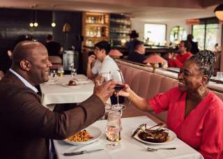 Couple toasting at dinner
