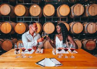 Couple toasting wine glasses on a date night