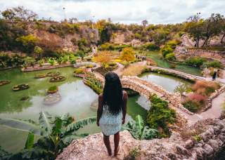 Woman overlooking lush Japanese Tea Garden