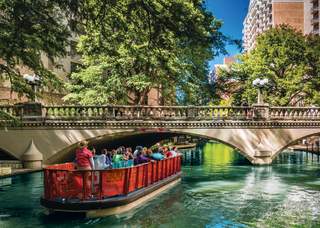 Boat passing under bridge