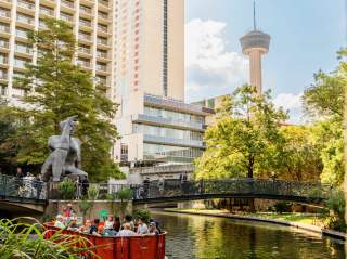 Go Rio river barge in front of Citlali / Stargazer sculpture.
