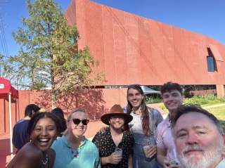 Group of people on a food tour in front of Ruby City in San Antonio.