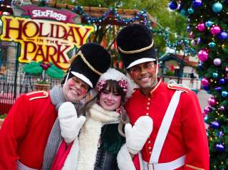 Costumed characters dressed as nutcrackers and Christmas elves at Holiday in the Park at Six Flags Fiesta texas.
