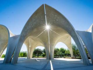Sun shine shining through structure at Confluence Park.