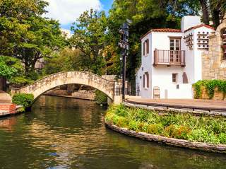 Water flowing under bridge at River Walk in front of Arneson River Theatre.