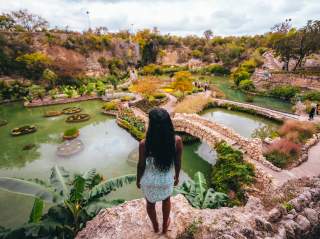 Woman overlooking lush Japanese Tea Garden