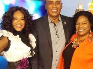 Man and two women smiling