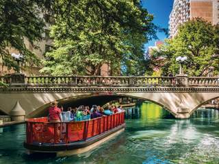 Boat passing under bridge