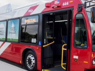 Public bus with doors open at bus stop