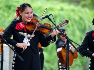 Mariachi band member playing violin