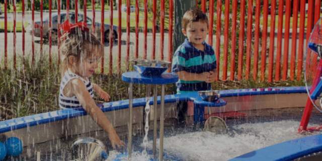 Kids playing with fountain