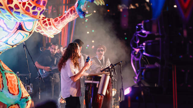 Band members on stage performing