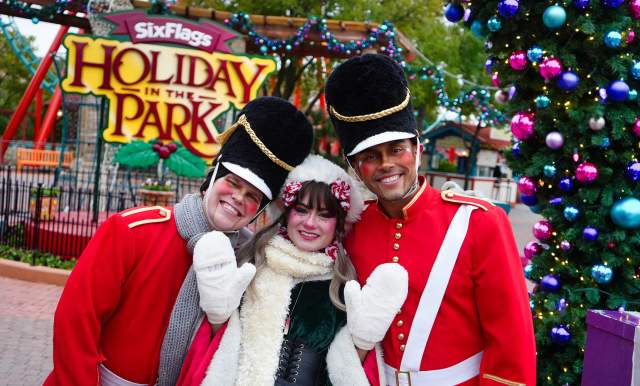 Costumed characters dressed as nutcrackers and Christmas elves at Holiday in the Park at Six Flags Fiesta texas.