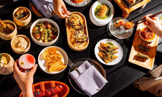 Overhead view of spread of food at Tenfold bar at Kimpton Santo in San Antonio.
