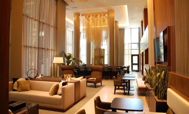 Tables and chairs in lounge area of AC Marriott.