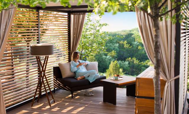 Woman relaxing at La Cantera Resort & Spa with drink