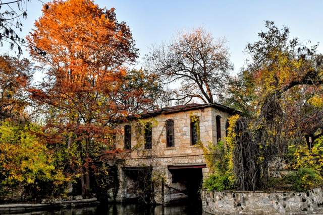 Stone building surrounded by trees