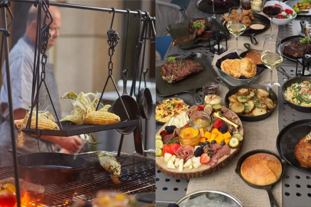 man cooking elote and large food spread