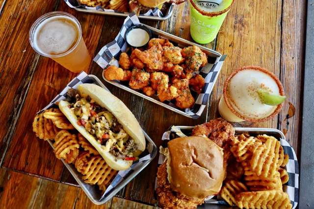 Overhead view of hamburger, fries, drinks
