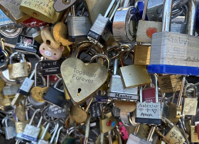 Padlocks with initials engraved and written on at San Antonio Love Lock Bridge.
