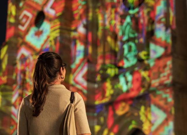 Woman looking at San Antonio | The Saga show at San Fernando Cathedral.