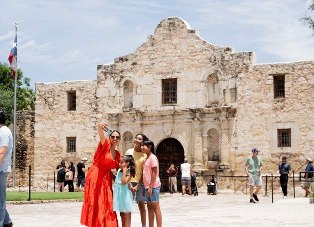 Family taking selfie at the Alamo.