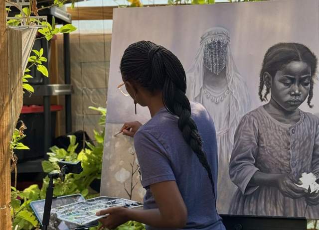 Ismani Sun painting on a canvas