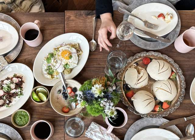 food spread out on a table with brunch food