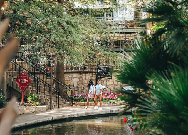 Couple strolling along River Walk
