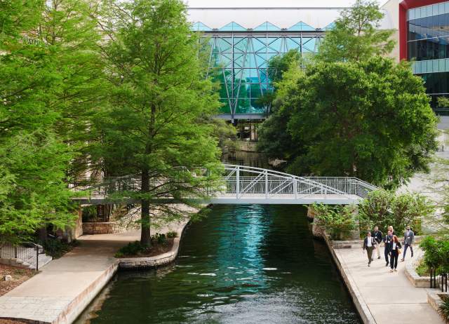 Professionals walking near bridge at Henry B. Gonzalez Convention Center