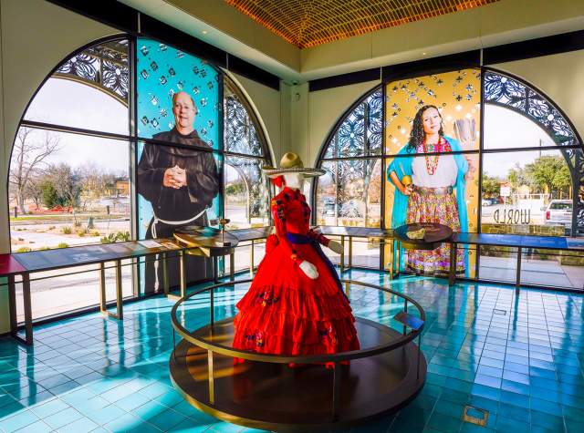 Interior view of World Heritage Center and mannequin in red dress.