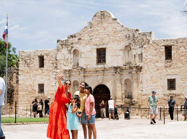 Family taking selfie at the Alamo.