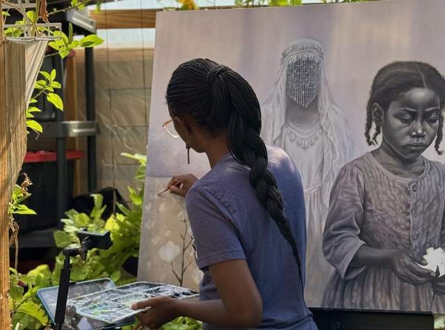 Ismani Sun painting on a canvas