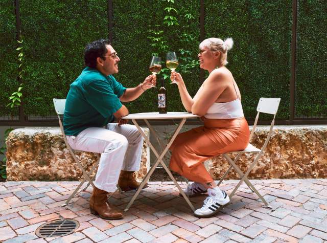 Couple enjoying wine cheersing