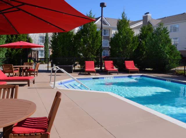 Hotel pool with red lounge furniture