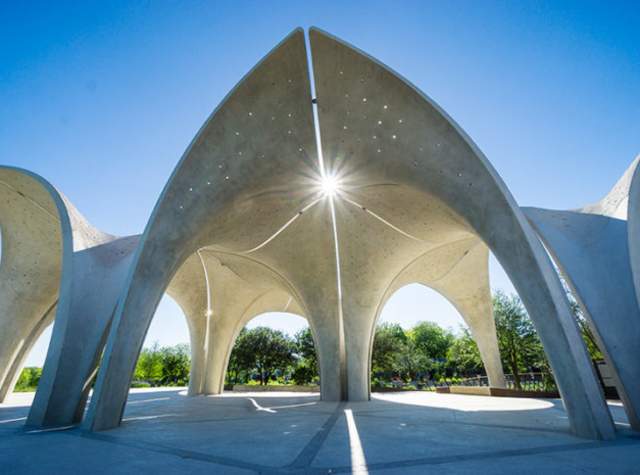 Outdoor dome sculpture with sun shining through crevice