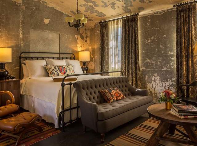 Boutique hotel room with iron frame bed