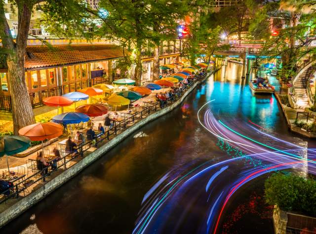 River Walk pathway lit with colorful umbrellas